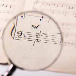 View through a magnifying glass of the notes in a music score